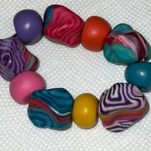 Acrylic beaded multi color stretchy bracelet. Never worn!!